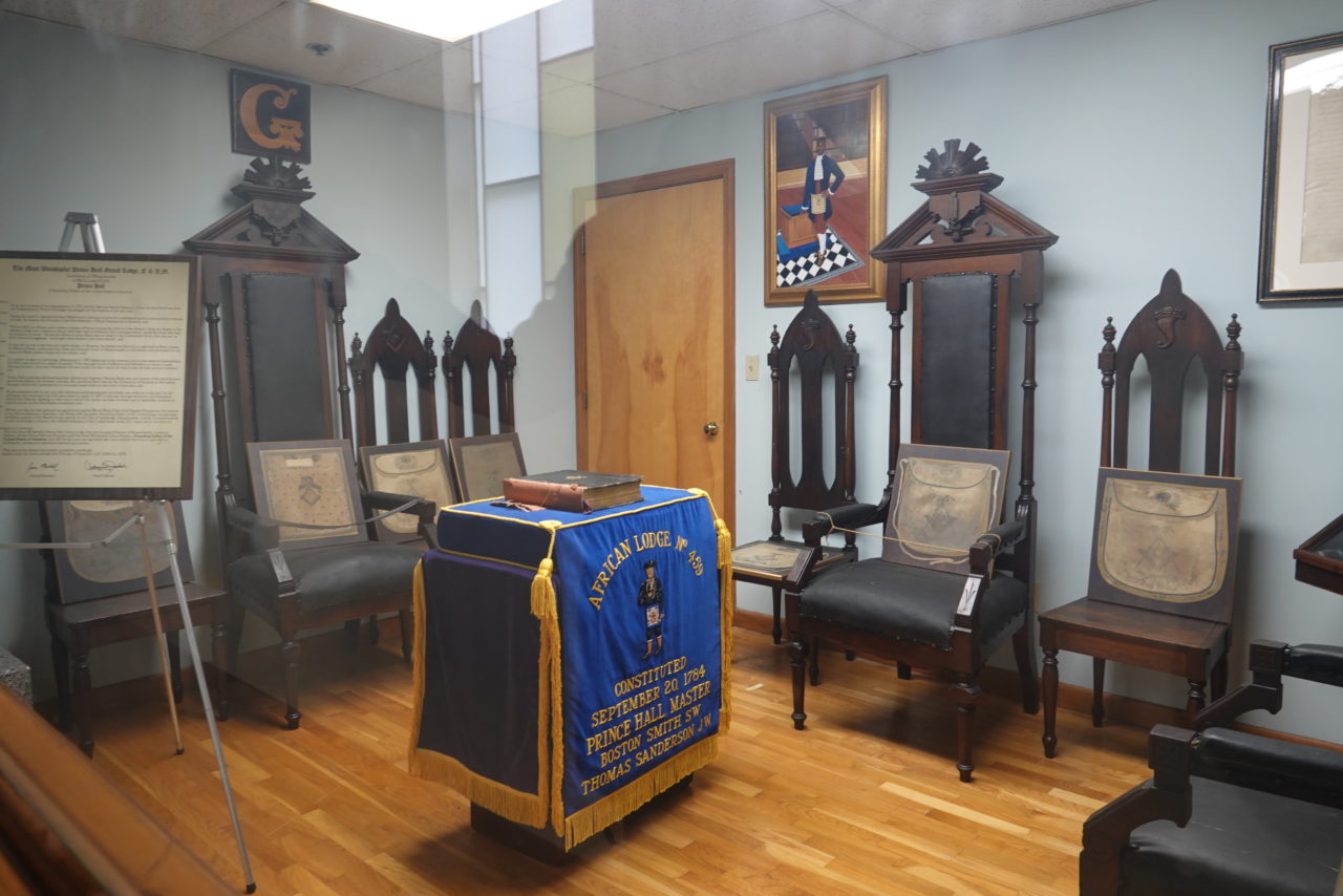 African Lodge room with an altar, chairs, aprons, and a portrait