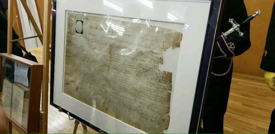 The original African Lodge No. 459 charter from the Grand Lodge of England, displayed behind glass
